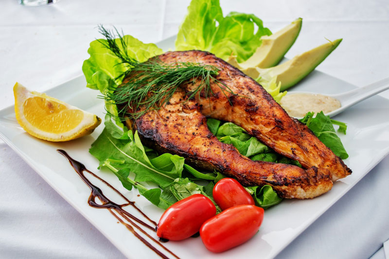 Grilled salmon plate at Comp Suite